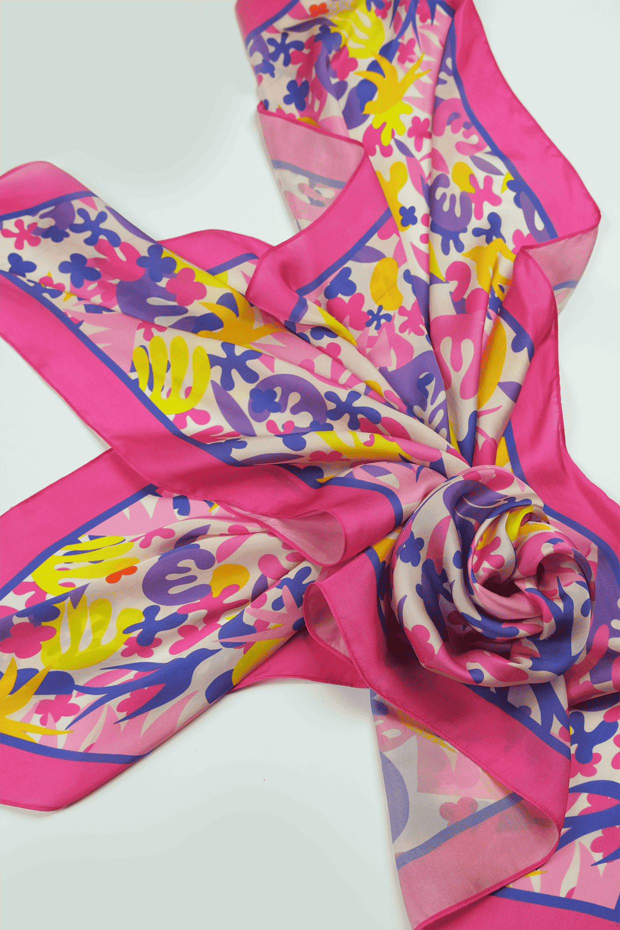 Colorful scarf with abstract patterns arranged on a white background